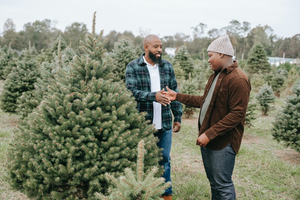 A man shaking hands with his teenage son. Photo by Any Lane: https://www.pexels.com/photo/positive-black-dad-making-deal-with-son-5727728/